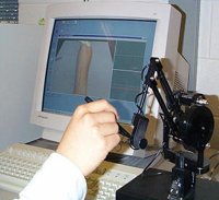 Photo of a computer and microscope